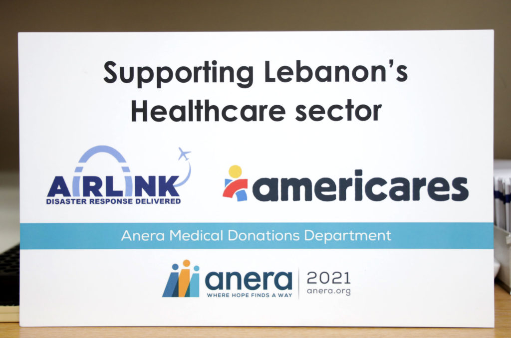 Americares, Airlink 281A8732-EDIT Sign noting Anera's partnership with Americares and Airlink