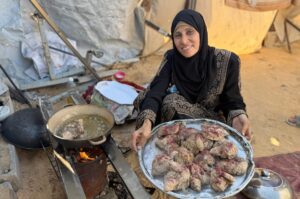 Um Zaki preparing to roast chicken for her musakhan