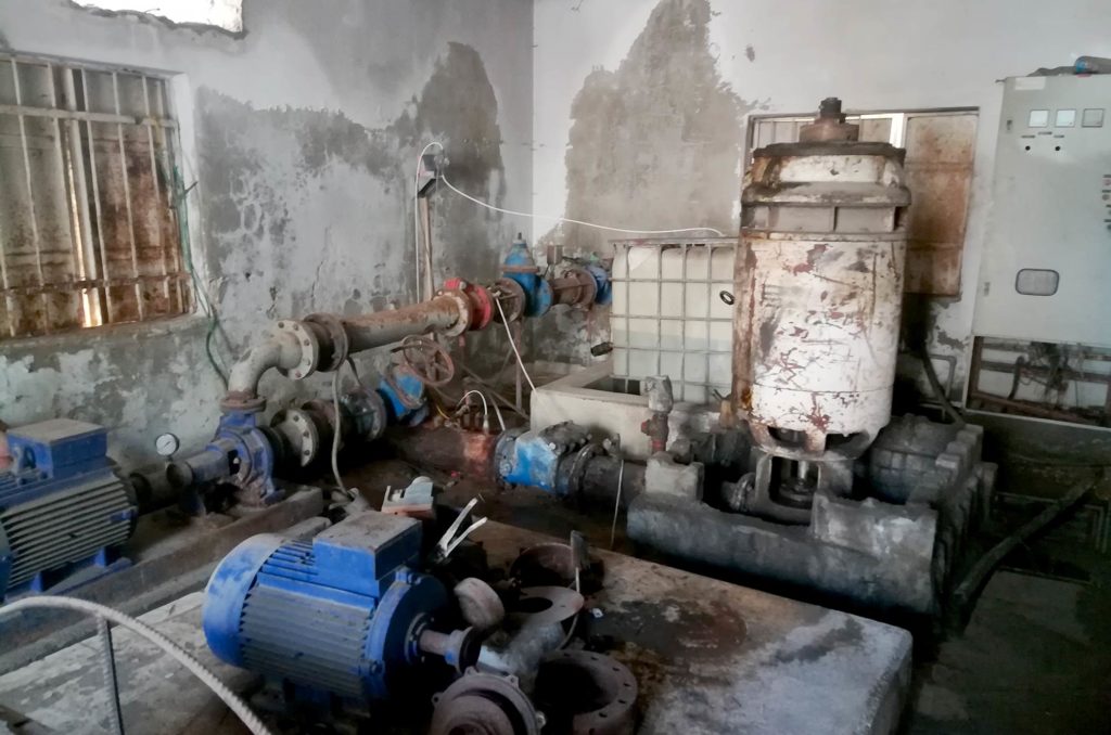 The decrepit existing water well pump equipment.