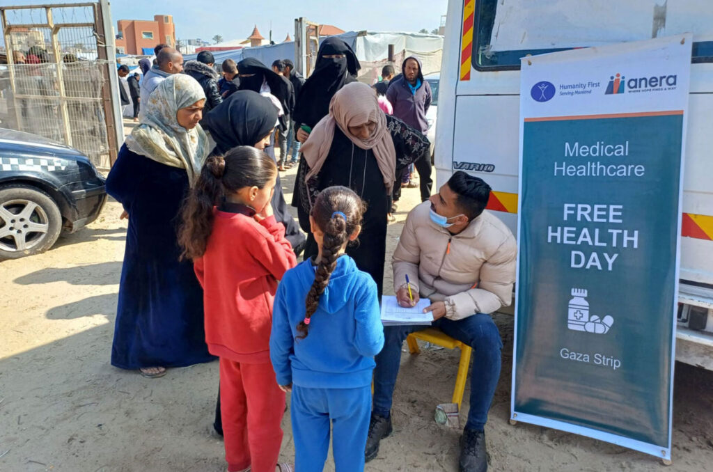 Children wait to enter a field clinic.