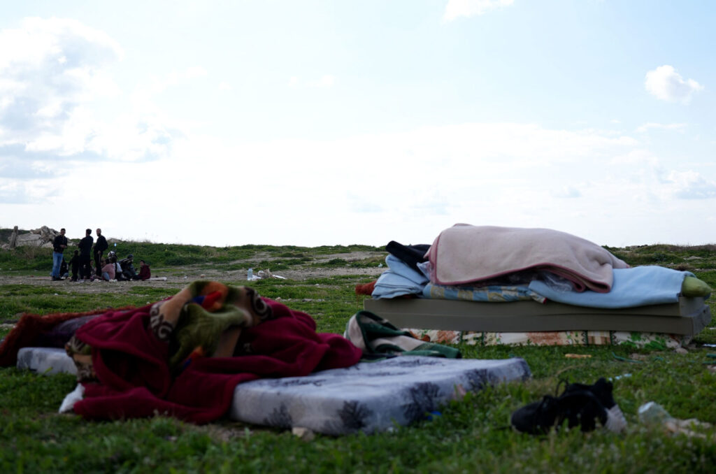 a displaced group in Lebanon, preparing to sleep outside