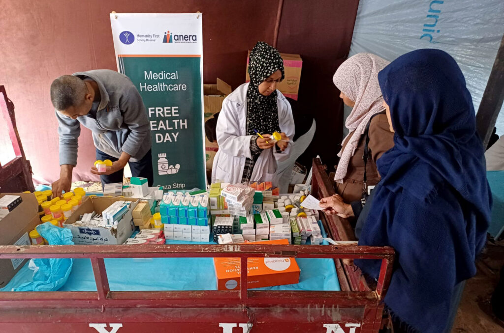 Gazans receive clinical care inside a field clinic.
