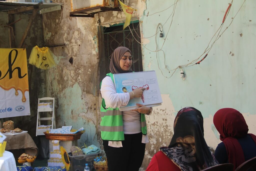 Women and girls in Burj El Barajneh at a menstrual hygiene awareness session in 2019.