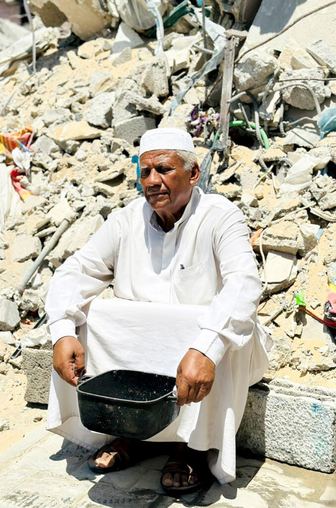 Anera-Abed-north-Gaza Abed, a 65-year-old resident of Gaza City, sits in front of the rubble of his house.