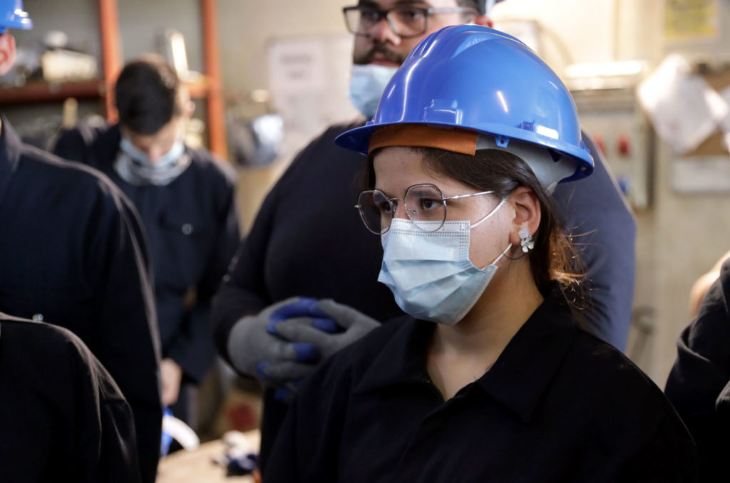 education, biomedical-electrical-maintenance, lebanon, vocational, youth, 281A6358-EDIT Hanan in hard hat and face mask at the training program.