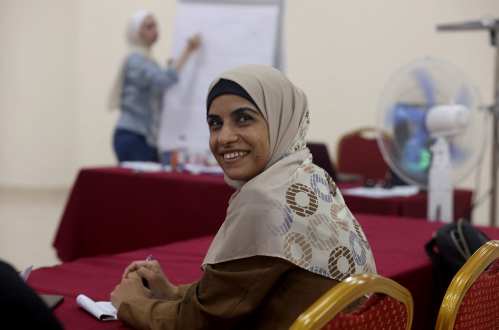 gaza, women's-cooperatives, women, coops, palestine, Maryam-Abu-Mohsen-EDITED Maryam smiles at the camera while seated at the training.