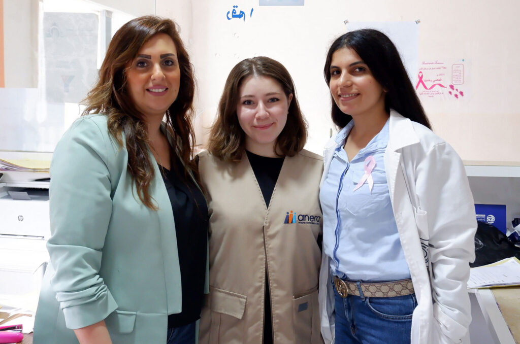 Hala Bashour and Anera's Jana Antar stand with an unidentified third person at Saint Paul Medical Center.