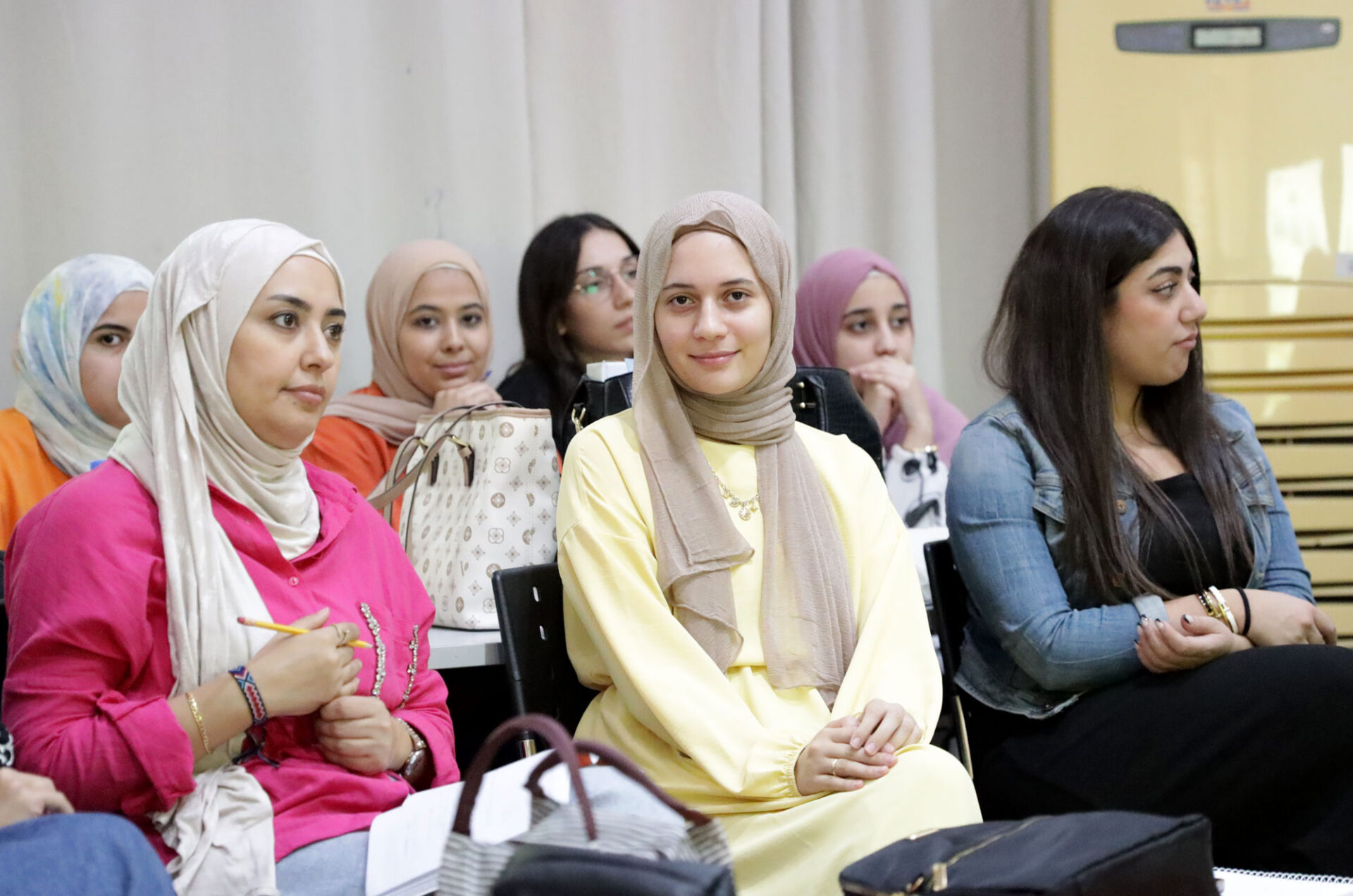 Fayza, seated with her classmates.