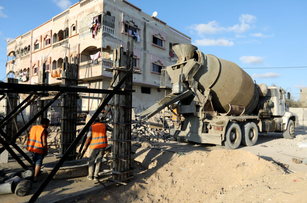 A cement truck at the construction site.