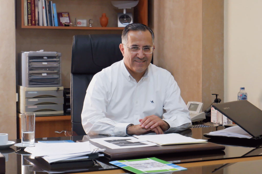 Nasser Adra at his desk.