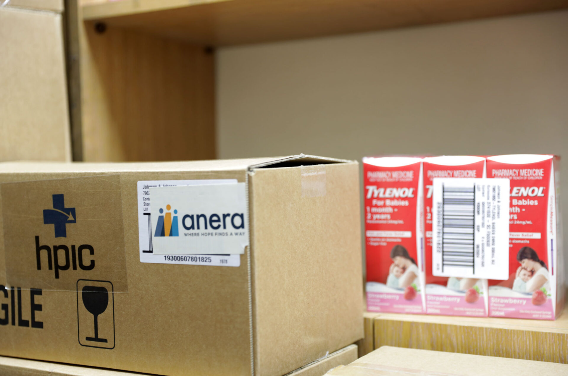Boxes of pediatric acetaminophen donated by HPIC and distributed by Anera to the Ibn Nafees Center pharmacy.