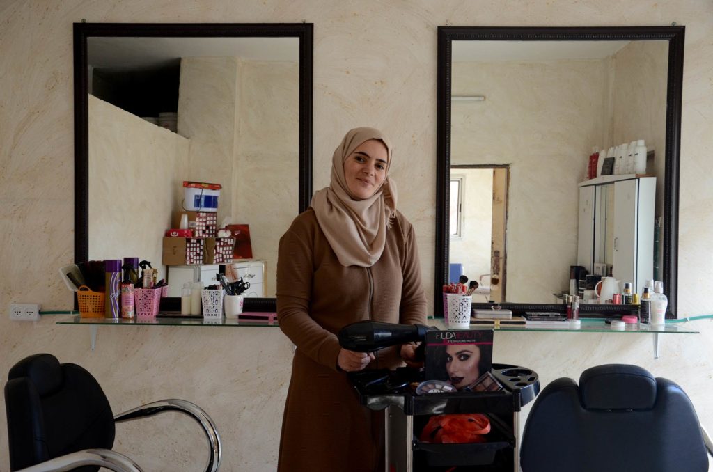 Abeer in her element at her beauty salon in Nablus.