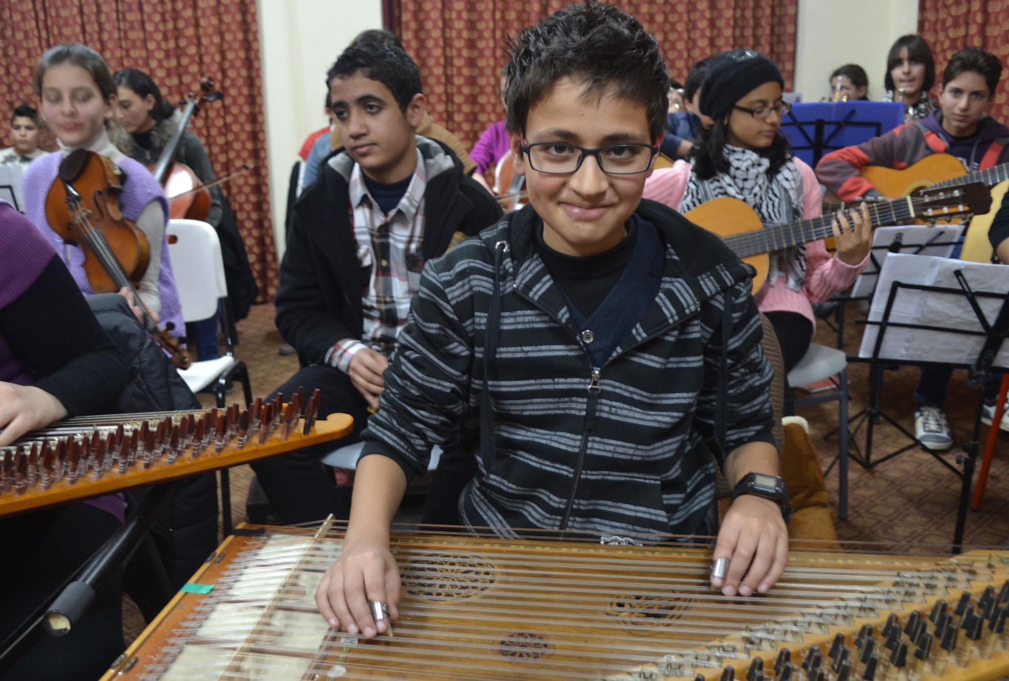 Gaza-Music-Education-4 Abdel plays qanun in the Gaza Music School orchestra.