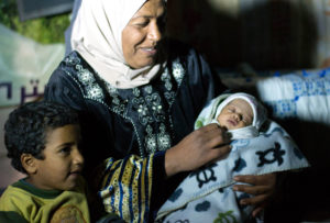 Palestinian refugee Arda and her youngest daughter in Ein El Hilweh, one of Lebanon refugee camps, where they found shelter from Syria conflict