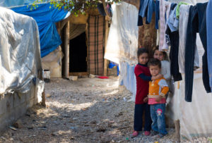 Children and their families end up in makeshift tents in Lebanon refugee camp after fleeing Syria conflict.