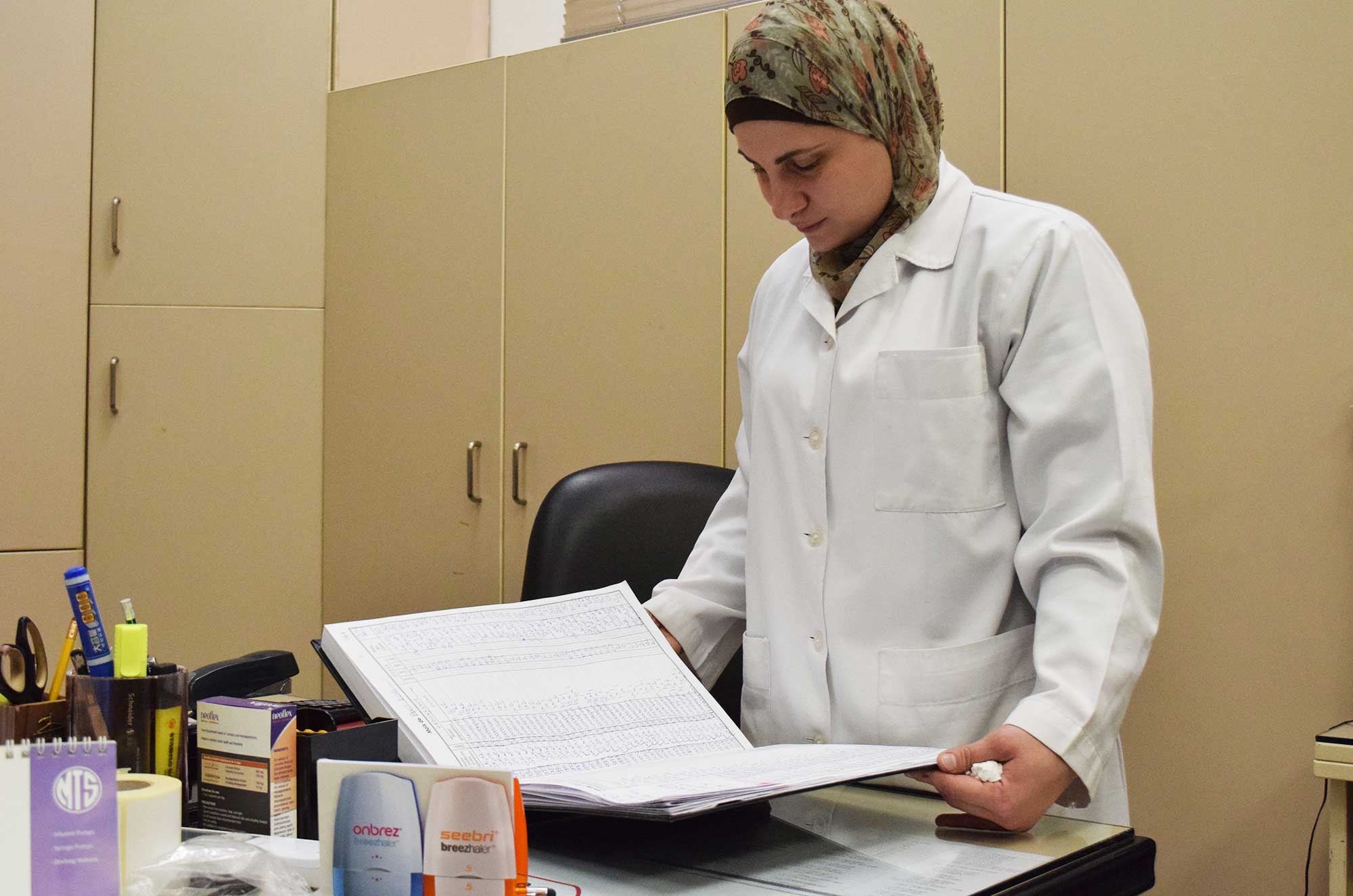 Razan, a pharmacist at Dar Al Ajaza, is relieved to get the medicine.