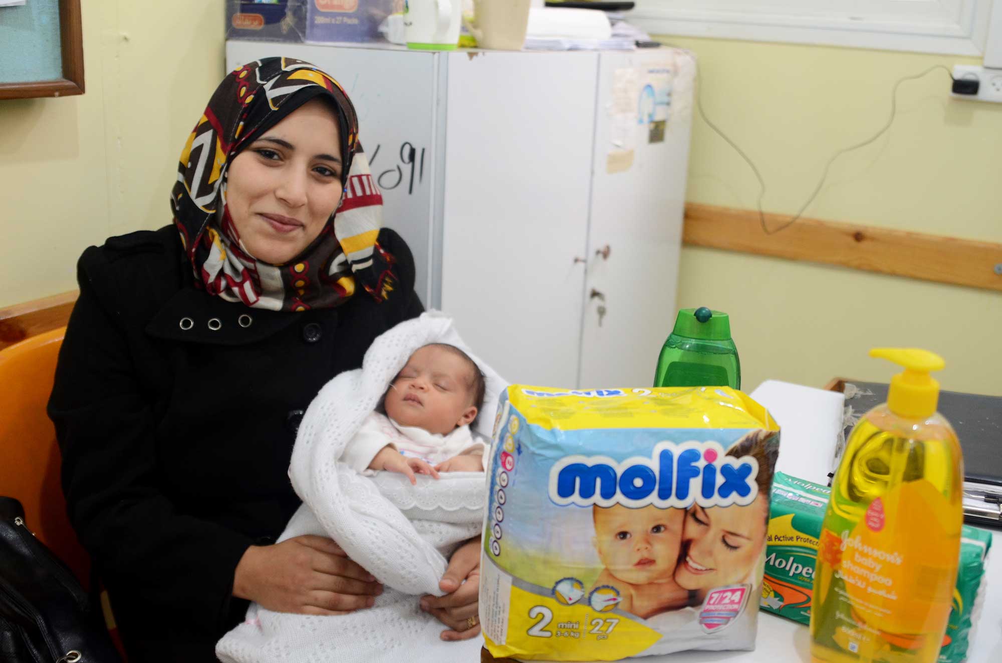 New mother Ohoud received a hygiene kit to help care for her 25-day-old baby girl, Mariya.