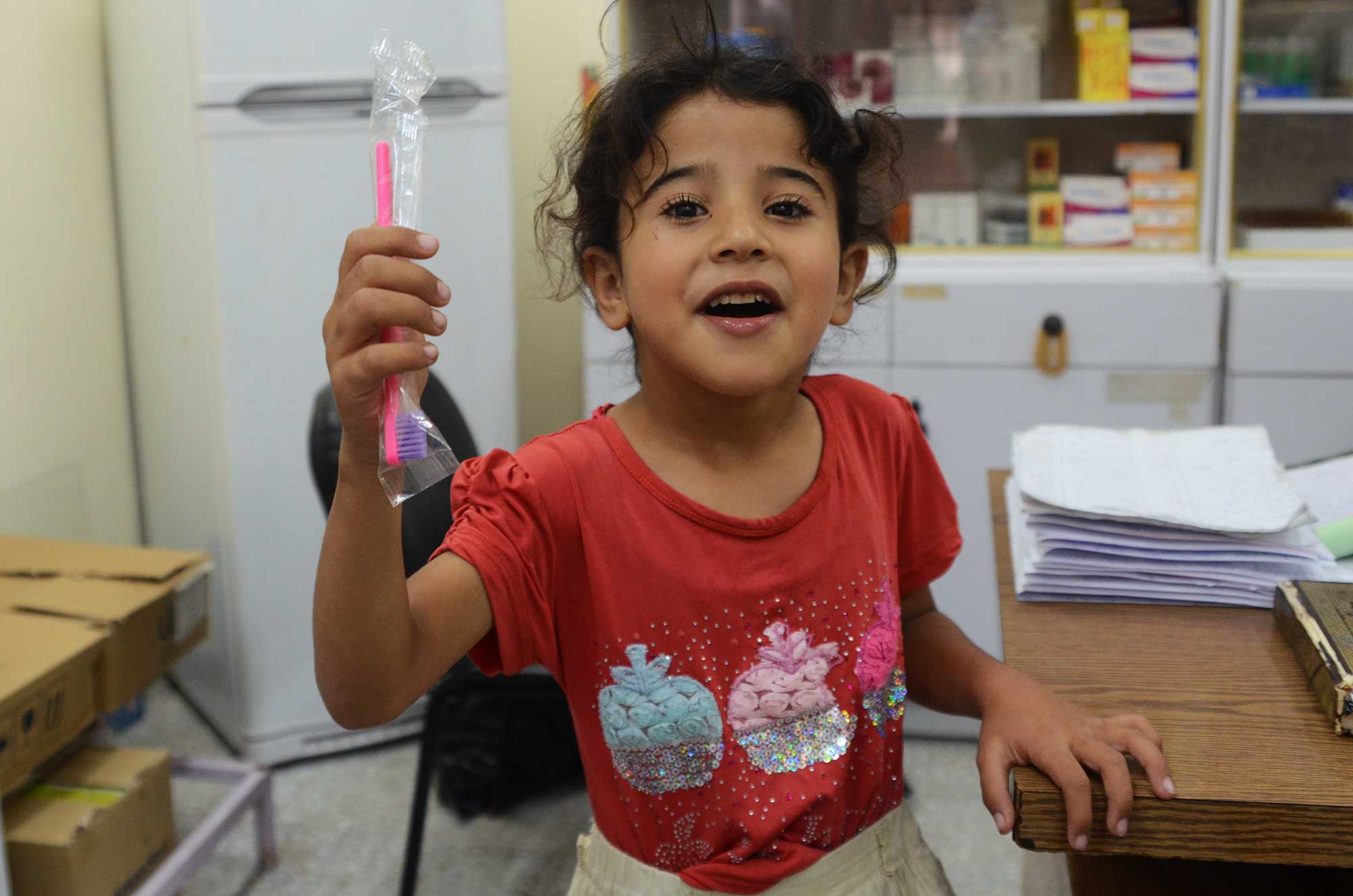 After receiving a new, pink toothbrush, 7-year-old Sundus decides going to the dentist isn't so bad.