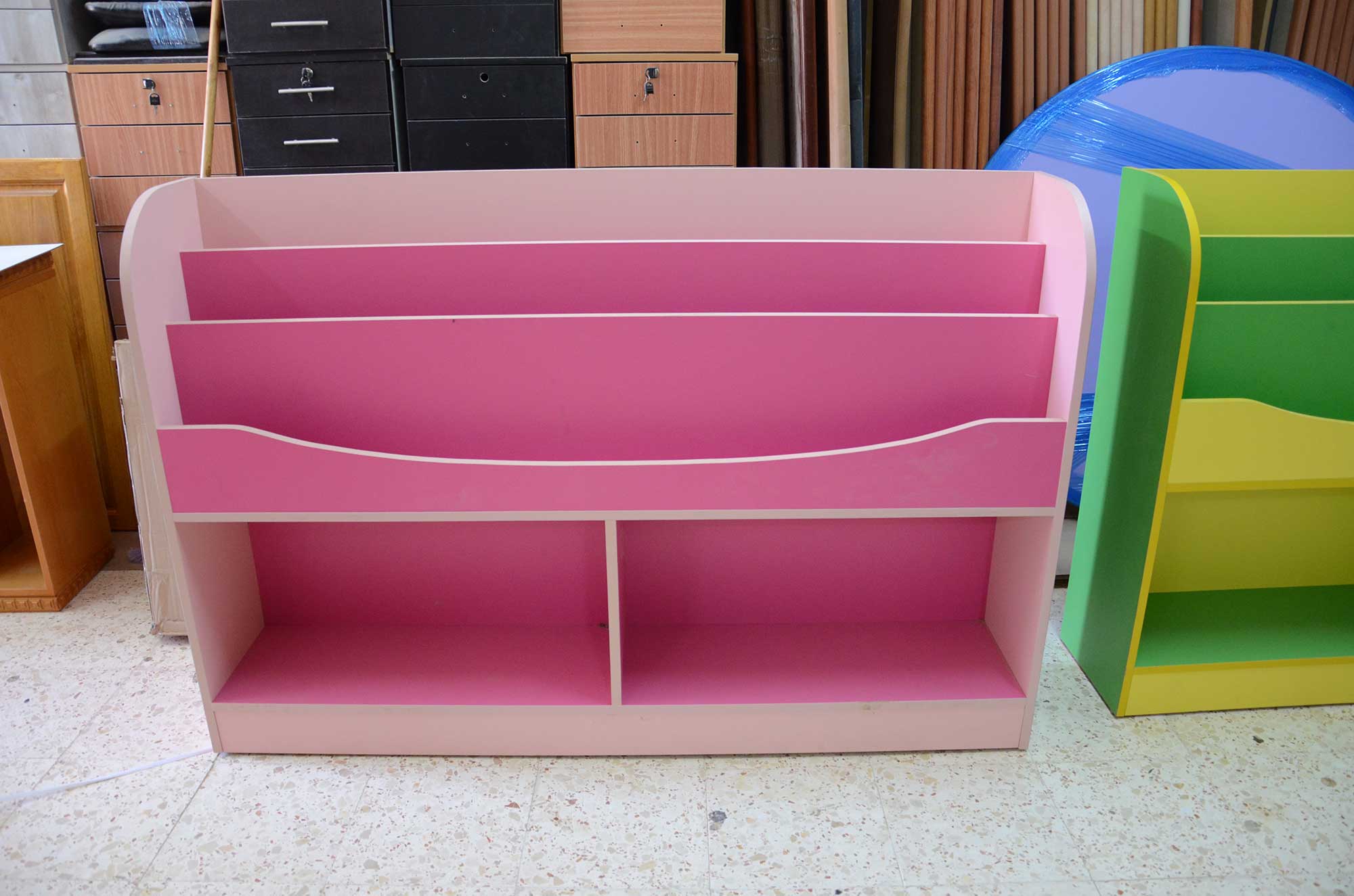 A pink bookshelf will infuse a preschool classroom with a positive, inviting vibe.
