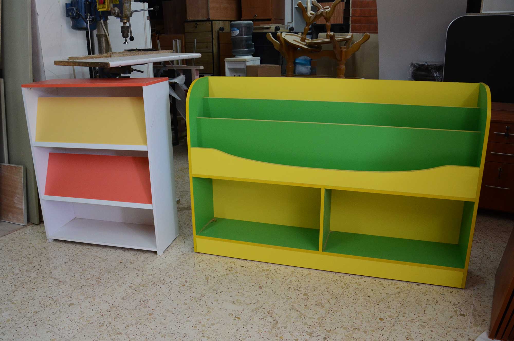 These colorful and height-appropriate shelving units were made by local carpenter, Fouad Nassar.