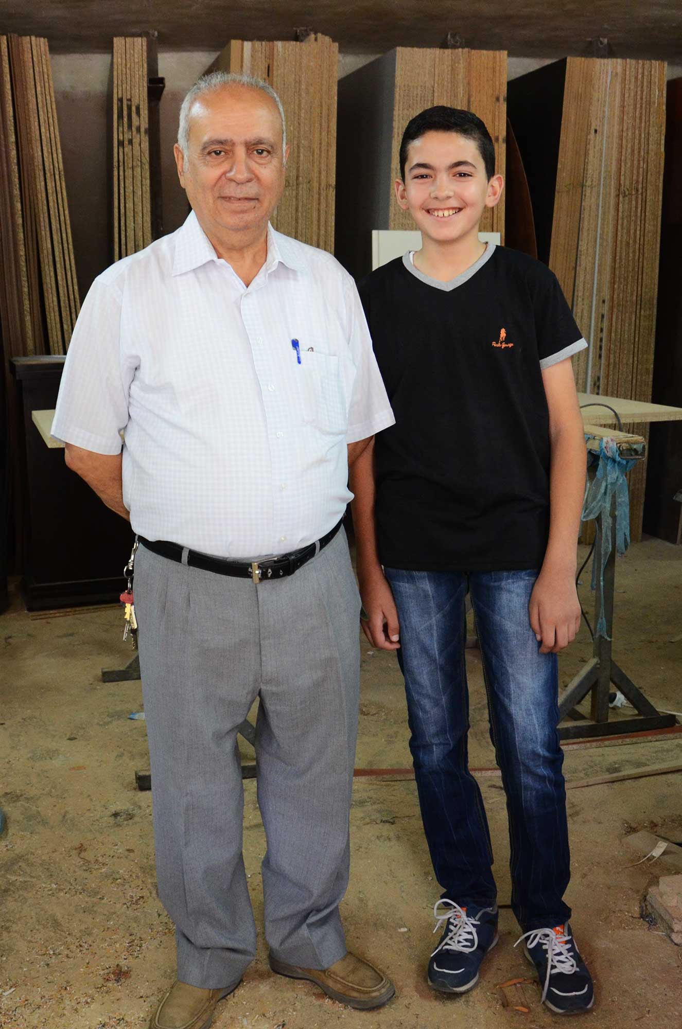 Fouad Nassar, founder of Nassar Office Furniture, stands next to his eldest grandson, Fouad Nassar Jr.