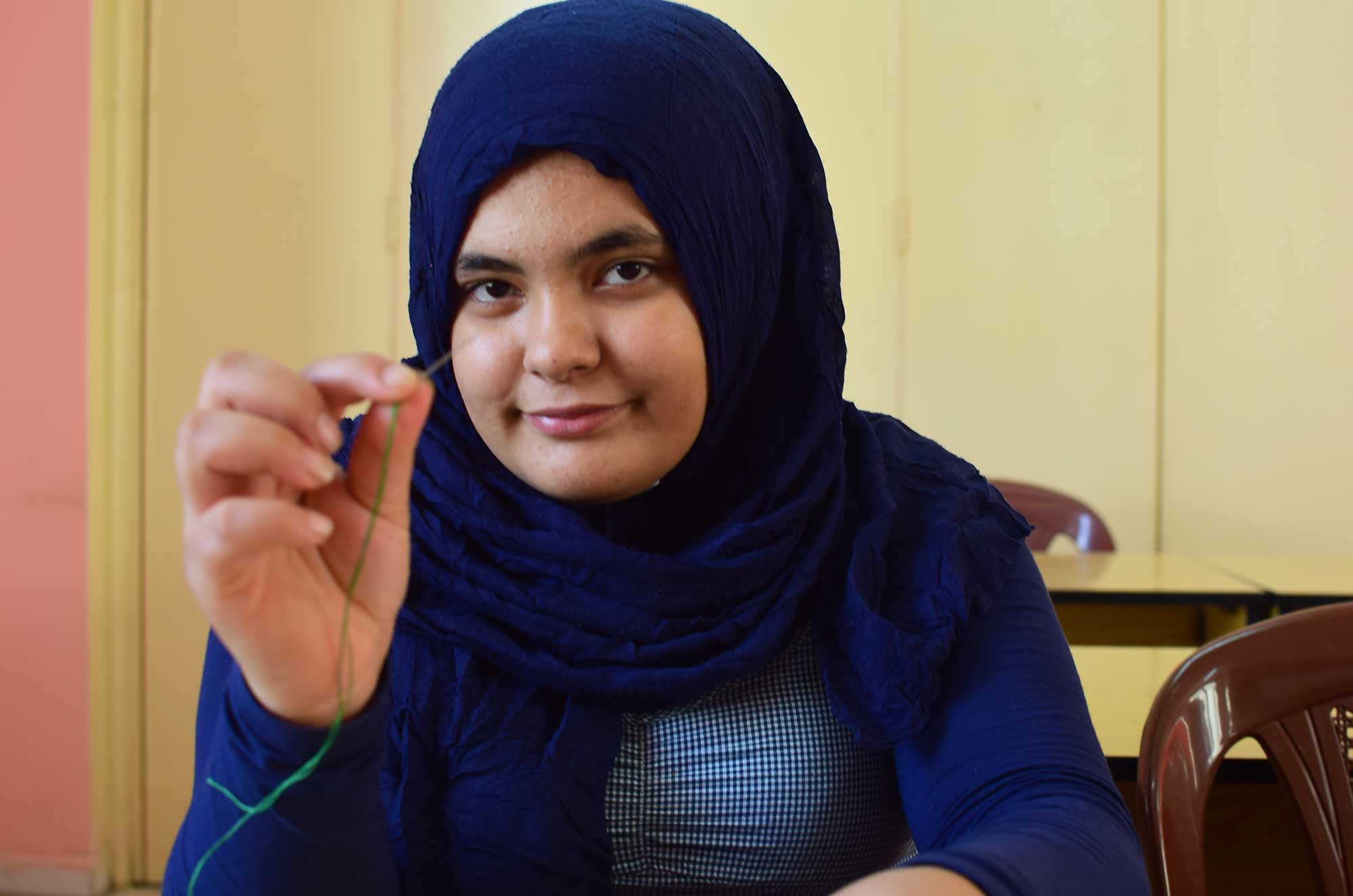 REFUGEE-GIRLS-1 Hiba says embroidery is part of her Palestinian heritage, and she wants to preserve it.