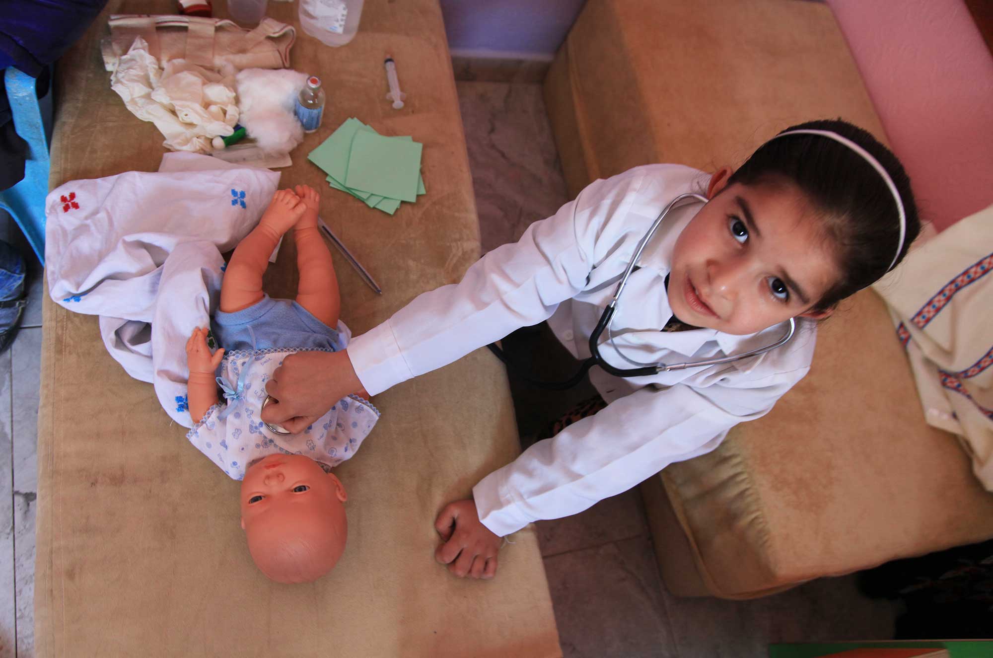 Pretend play helps children in Gaza develop motor skills.