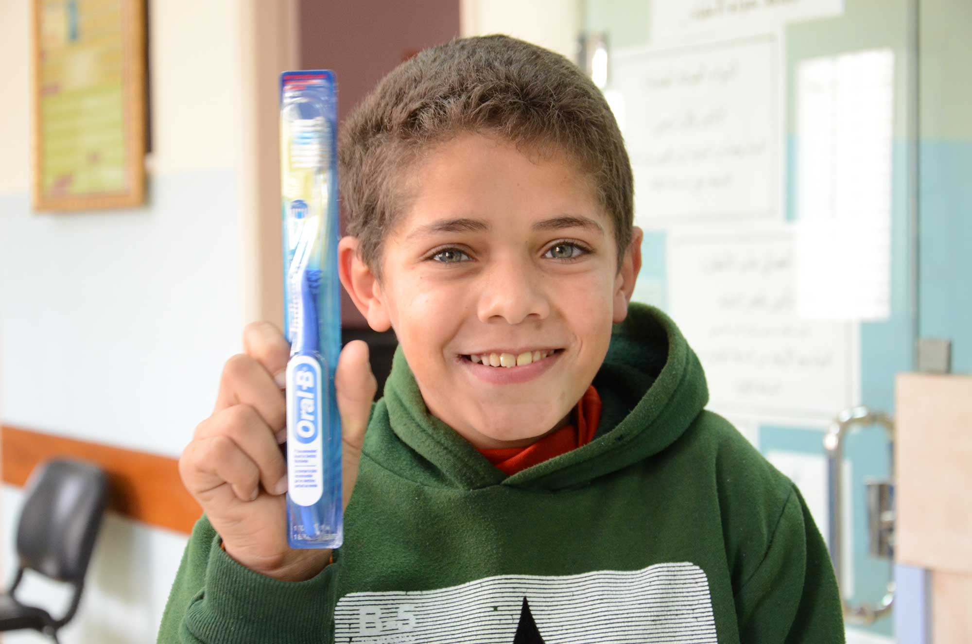 medi 11-year-old Mus'ab is smiling again thanks to the charitable clinic supported by Anera's medical distributions.