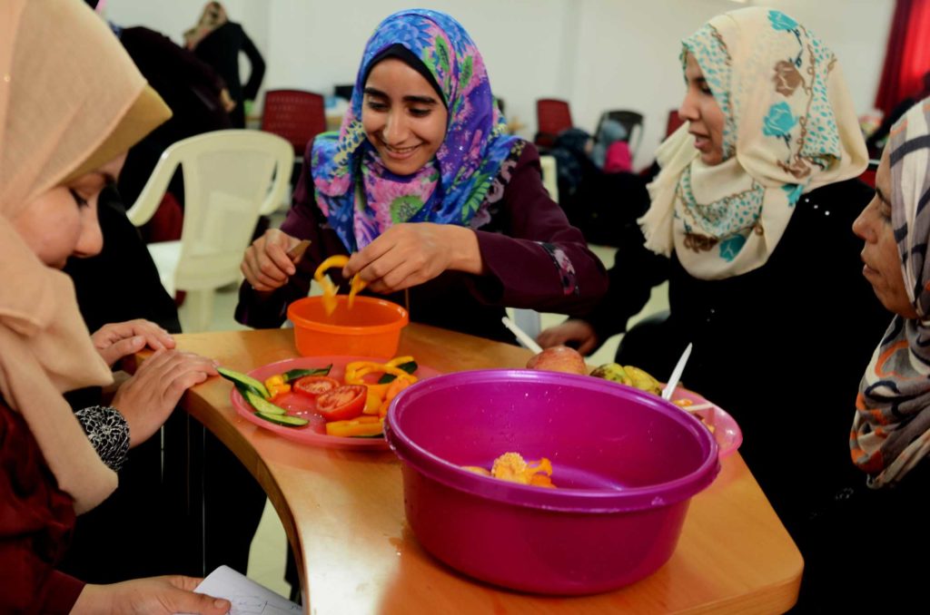 Preschool teachers in Gaza learn to incorporate expressive arts and healthy foods into preschool curriculum in an in-service workshop.