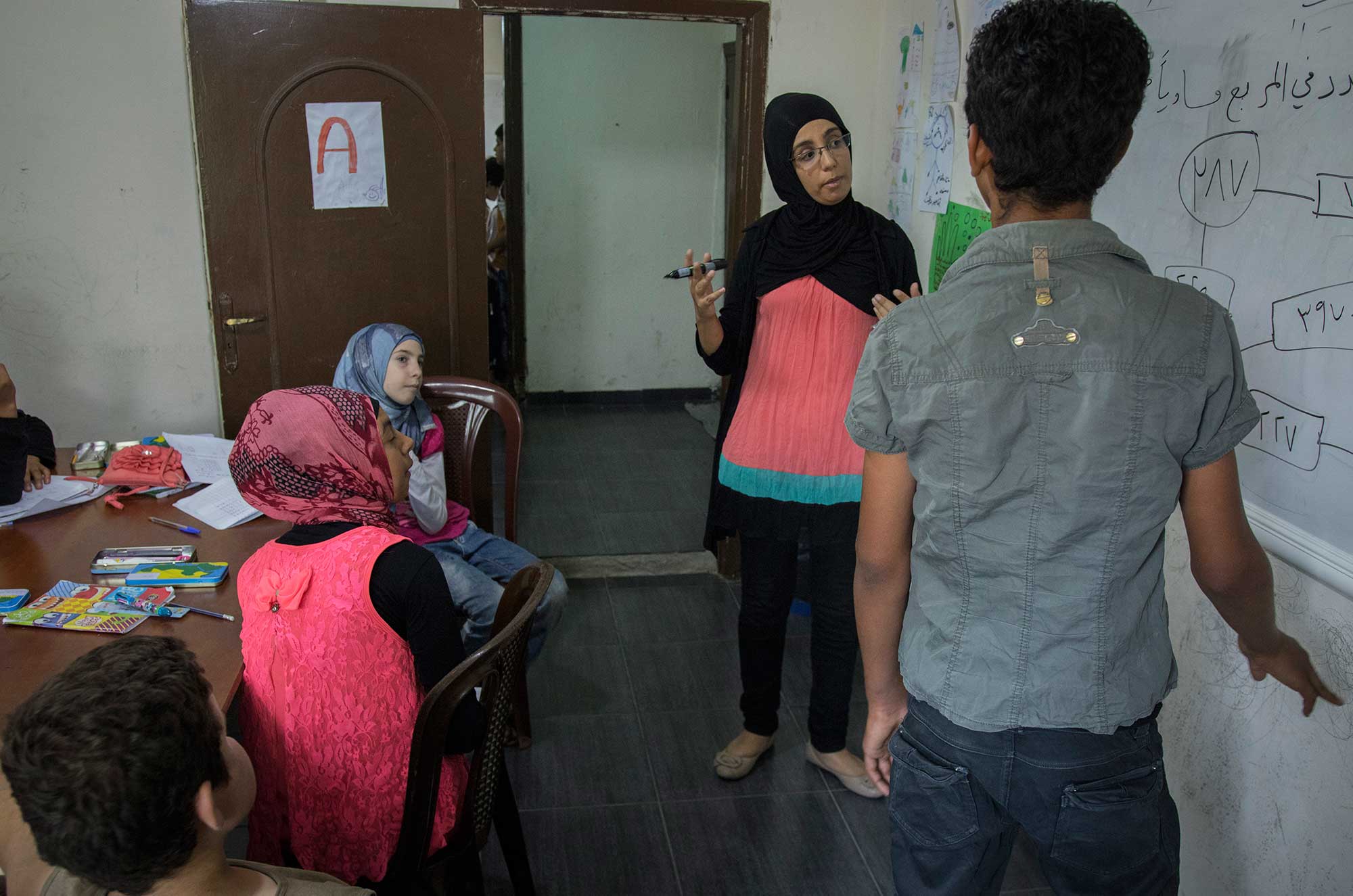 Abed is a 14-year-old Syrian refugee from Damascus. He's lived in Bhannine for four years and has had trouble going back to school. "What I learn here helps me keep up in school. My math skills are great now!" he says.