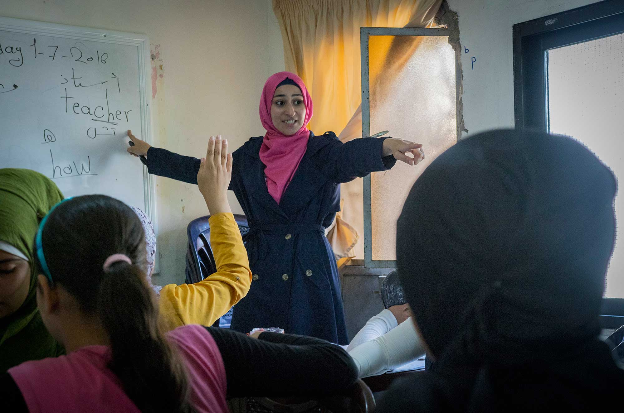 Noor, a Lebanese teacher, uses interactive methods to teach English to her students in Bhannine.