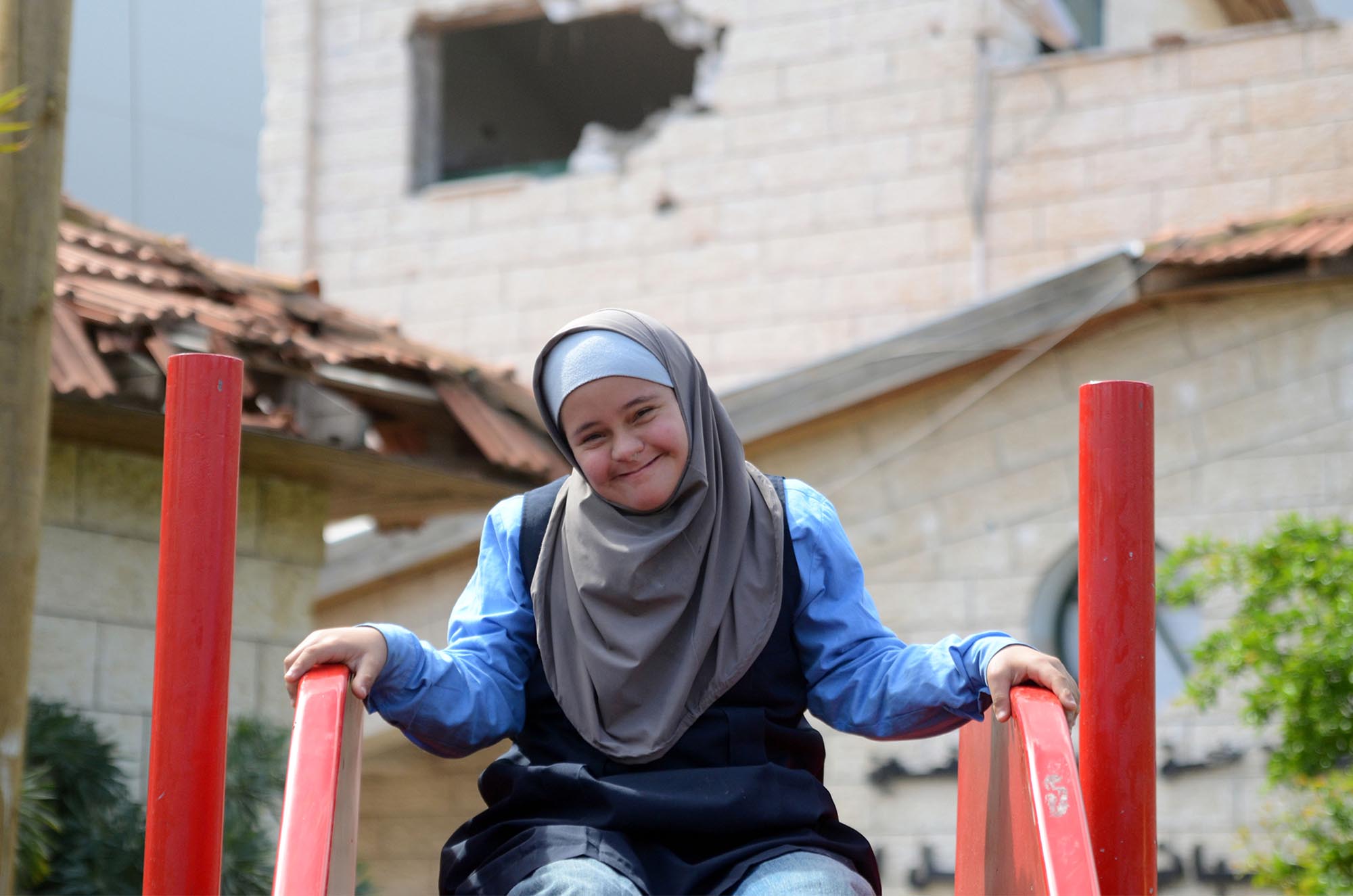 While the rest of the facility was damaged during the Gaza bombings, the playground at the Right to Live Society remains intact.