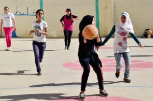 Refugee girls in Lebanon play basketball as part of Anera's sports for Peace and Development Program.