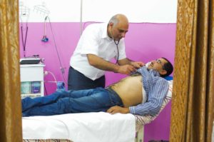 Asthma patient Ismail picks up his donated medication in Dura, Hebron, Palestine.