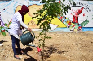 Youth volunteers in Nahr El Bared refugee camp combat the Lebanon trash crisis by collecting and sorting waste, planting trees