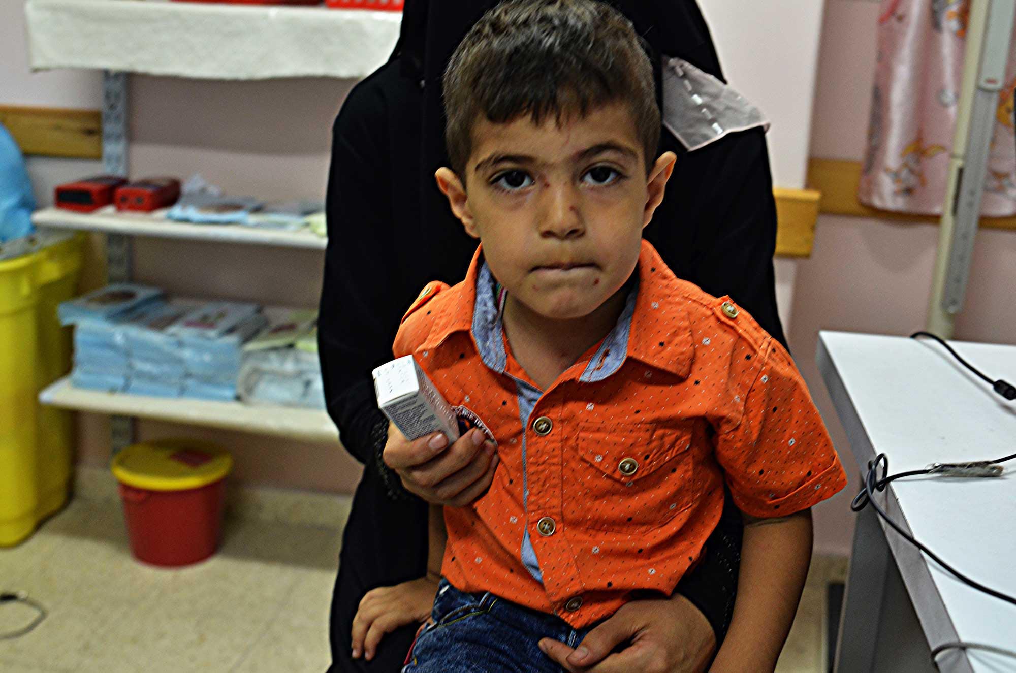 shej4 Malek needs medicine for his skin ailment in Shejaiya, Gaza.