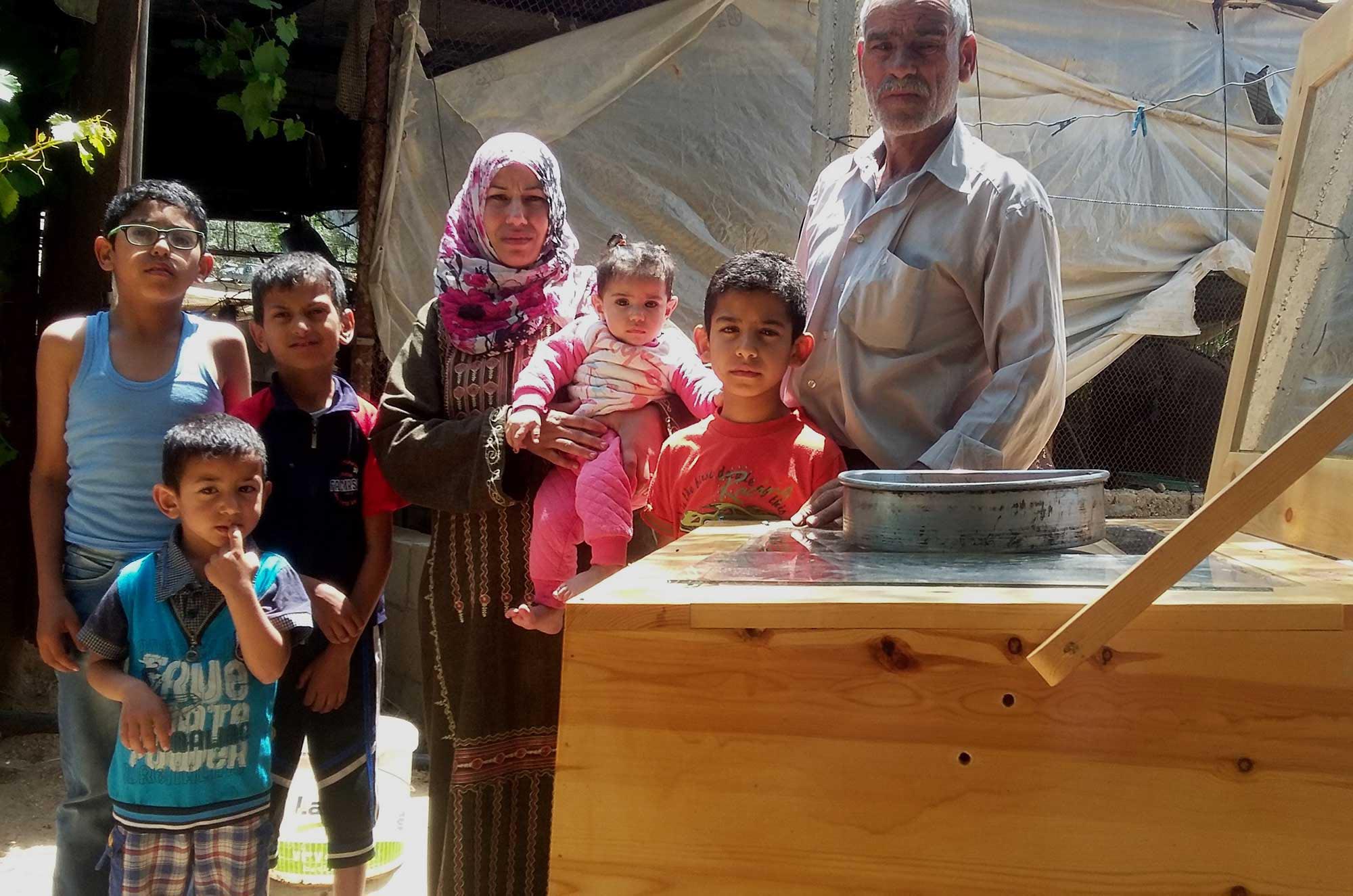 Sumaya takes care of her children and her disabled husband. She depends on the greenhouse and solar cooker to provide meals for her family.