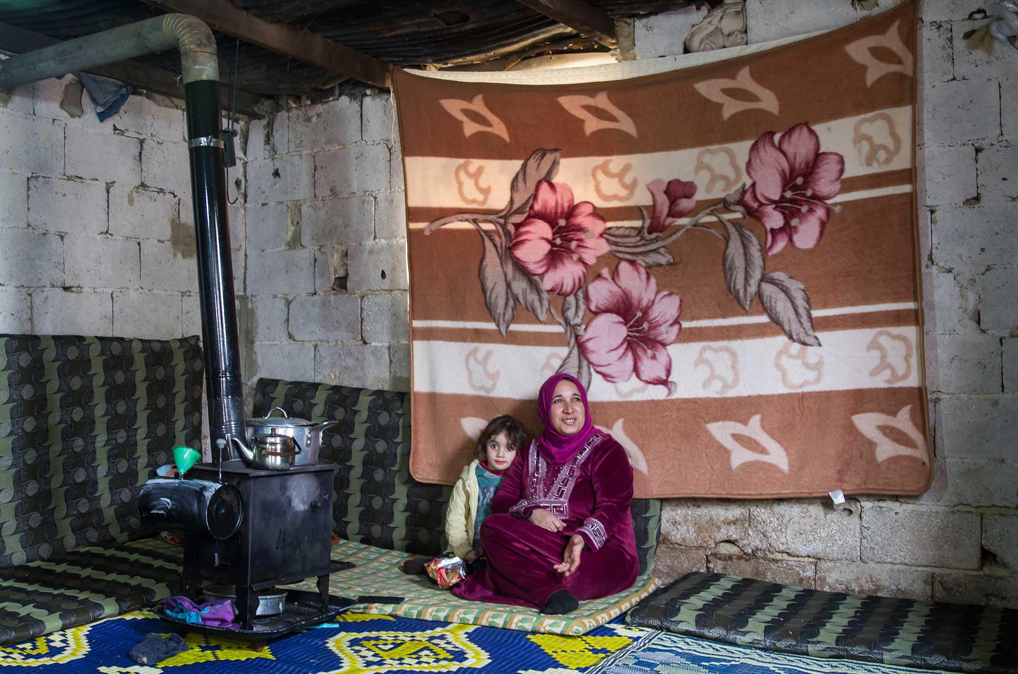 Nadia lives in a barn that provides little protection for Syrian refugees in winter.