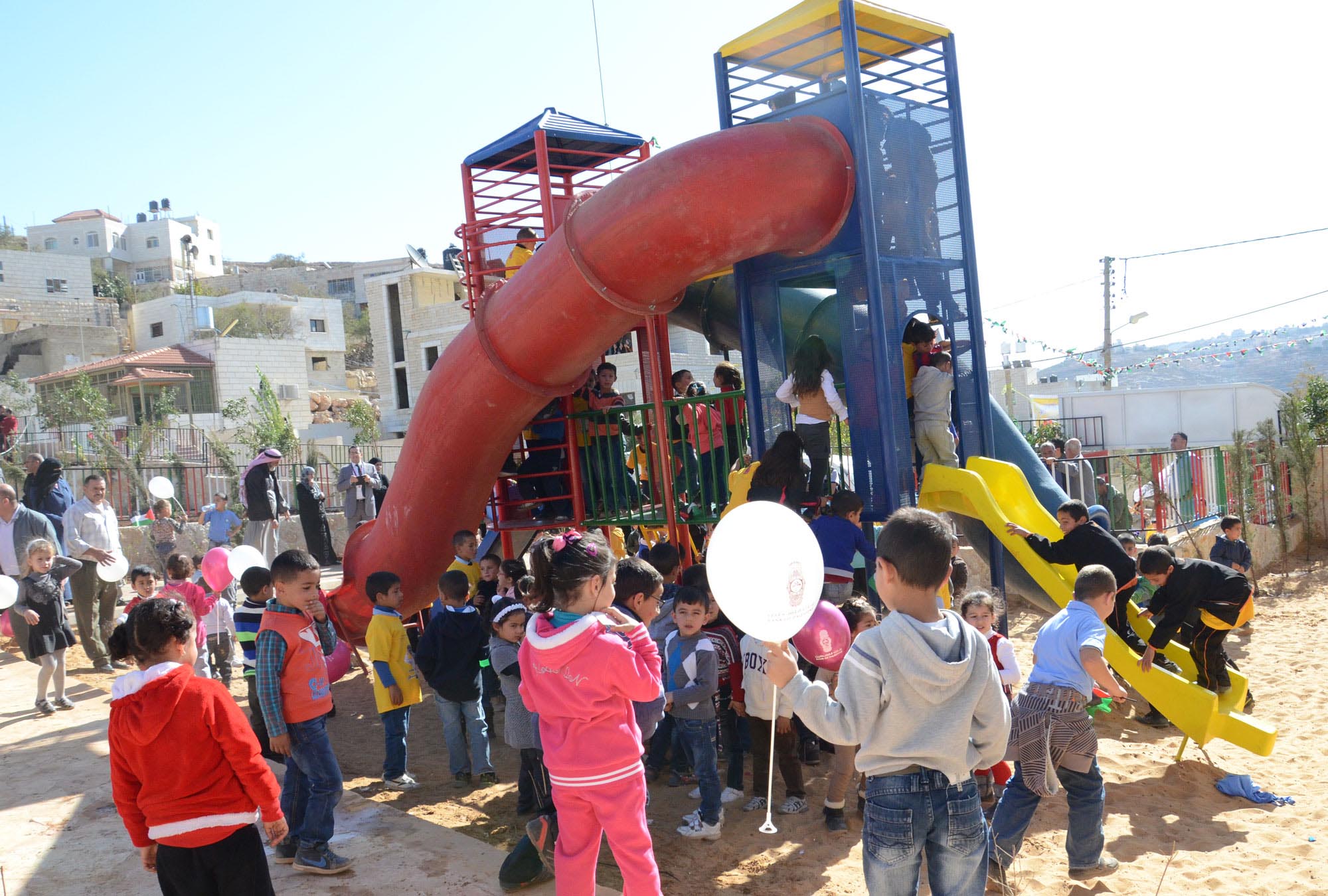 The jungle gym and other new, colorful playground equipment that Anera installed are a big hit with the children of the West Bank village of Abu Falah.