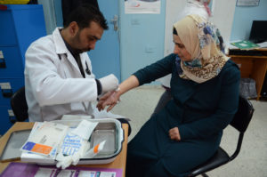 Shireen receives treatment for severe burns in a Palestinian clinic.