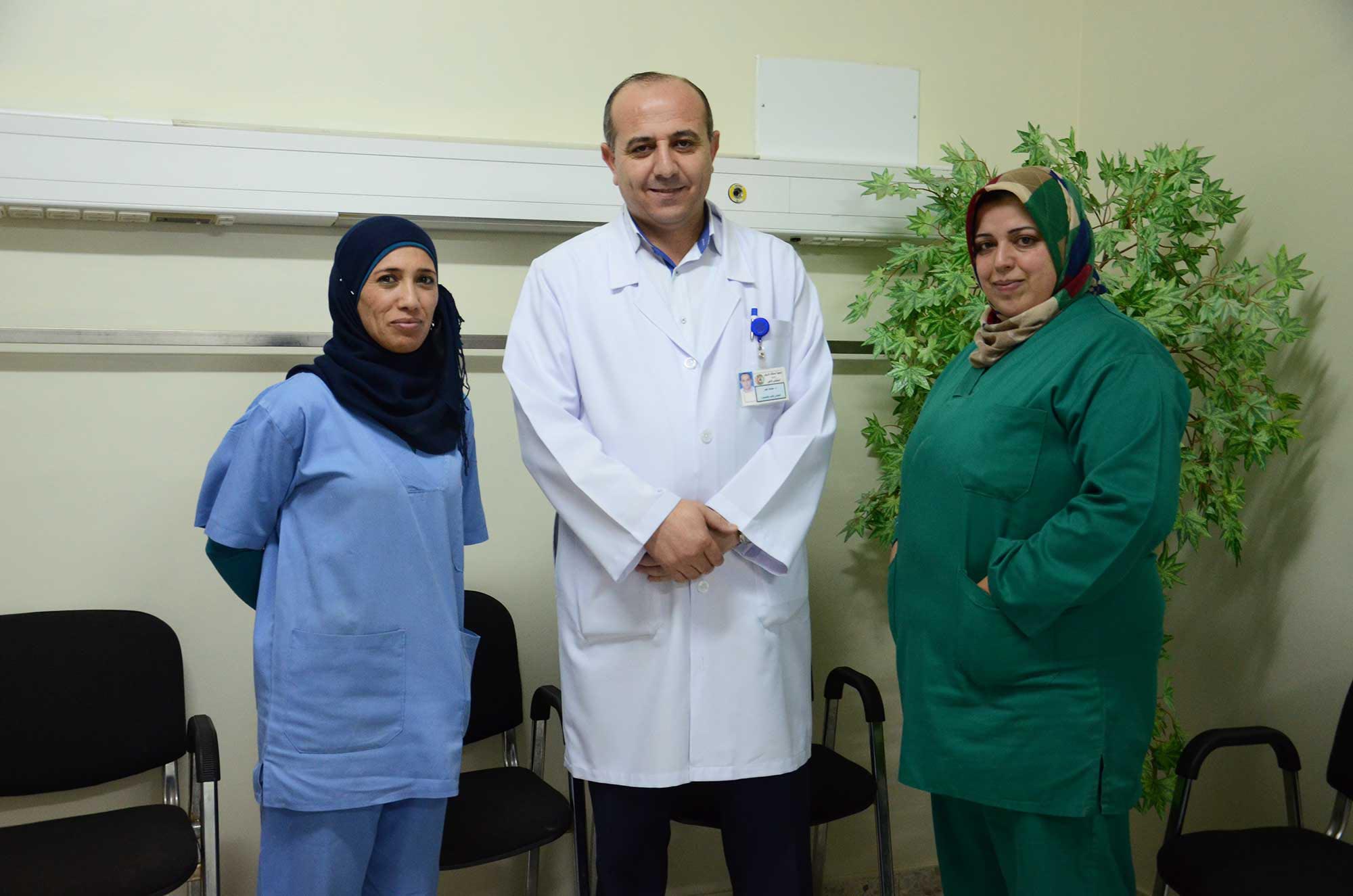Dr. Nasr and two nurses provide quality care in their cardiac department at the Hebron hospital.