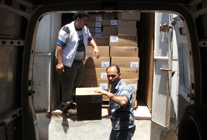 Ambulance picking up medicines at Anera’s Gaza city warehouse.