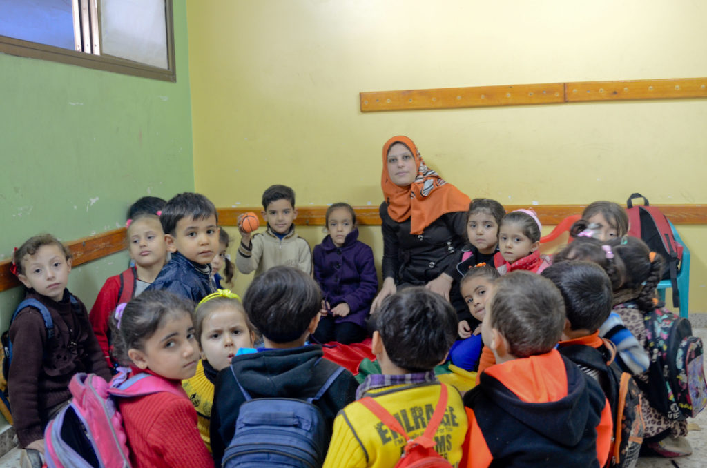 Gaza Preschool Teacher Finds Inspiration (2) In her Gaza preschool classroom, Inshirah is very attentive to her children.