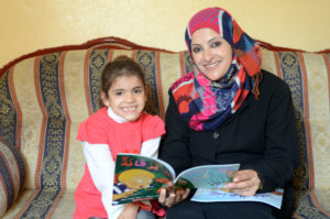 anadi, pictured with her preschool-age daughter Jomana, has realized the importance of reading at home.