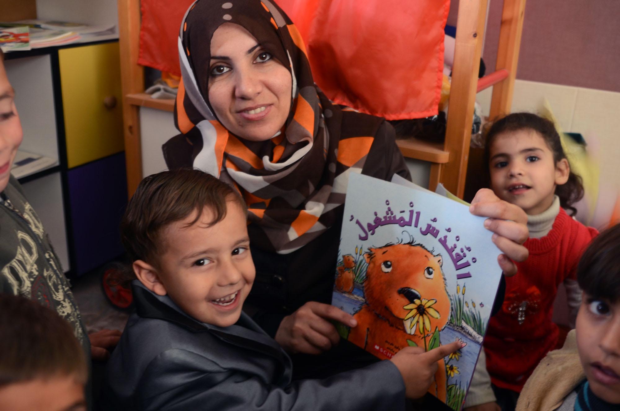 In her preschool class in Beit Lehia, Masouin reads new stories to excited Gaza children.