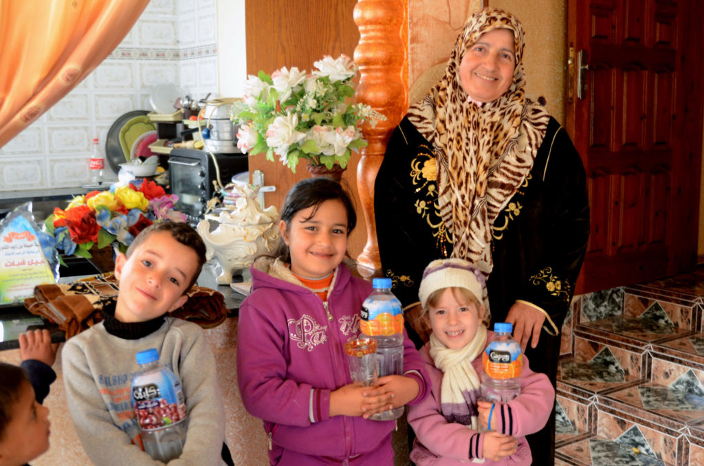 Sabah and her grandchildren are very grateful for restored access to water in their home.