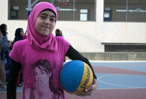 13-year-old Razan is excited about being with friends and playing basketball as part of Anera's sports for peace programming in Lebanon.