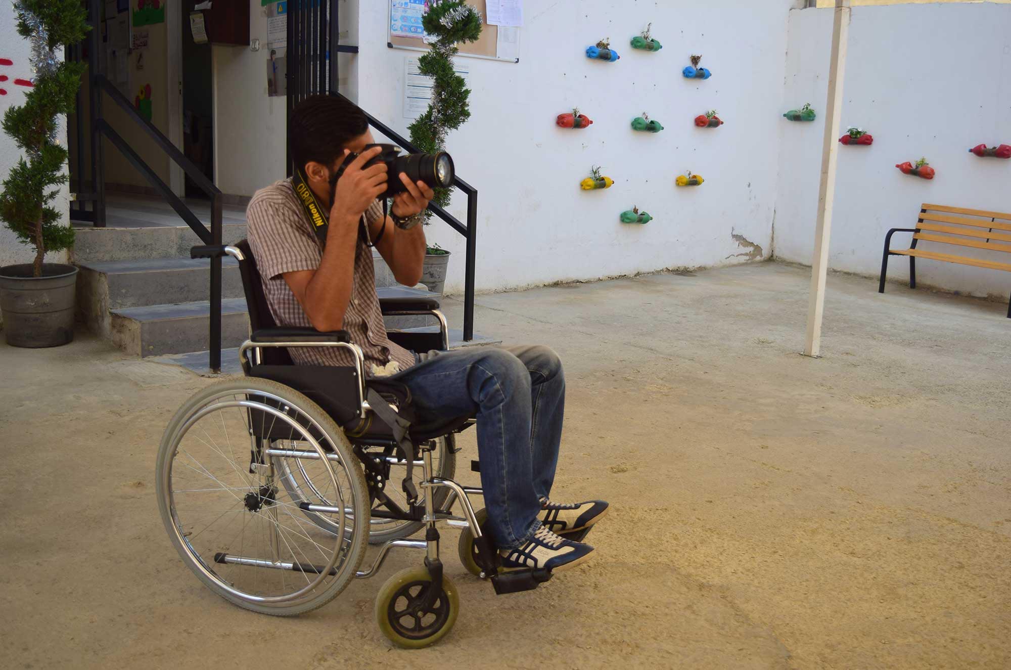 PARALYZED-SYRIAN-2 While he still hopes to become an engineer one day, Adnan has discovered photography a passion for photography.