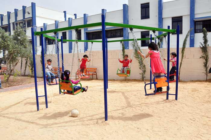 A colorful playground in West Bank village of Ras Karkar after its transformation from an empty rock-filled field.