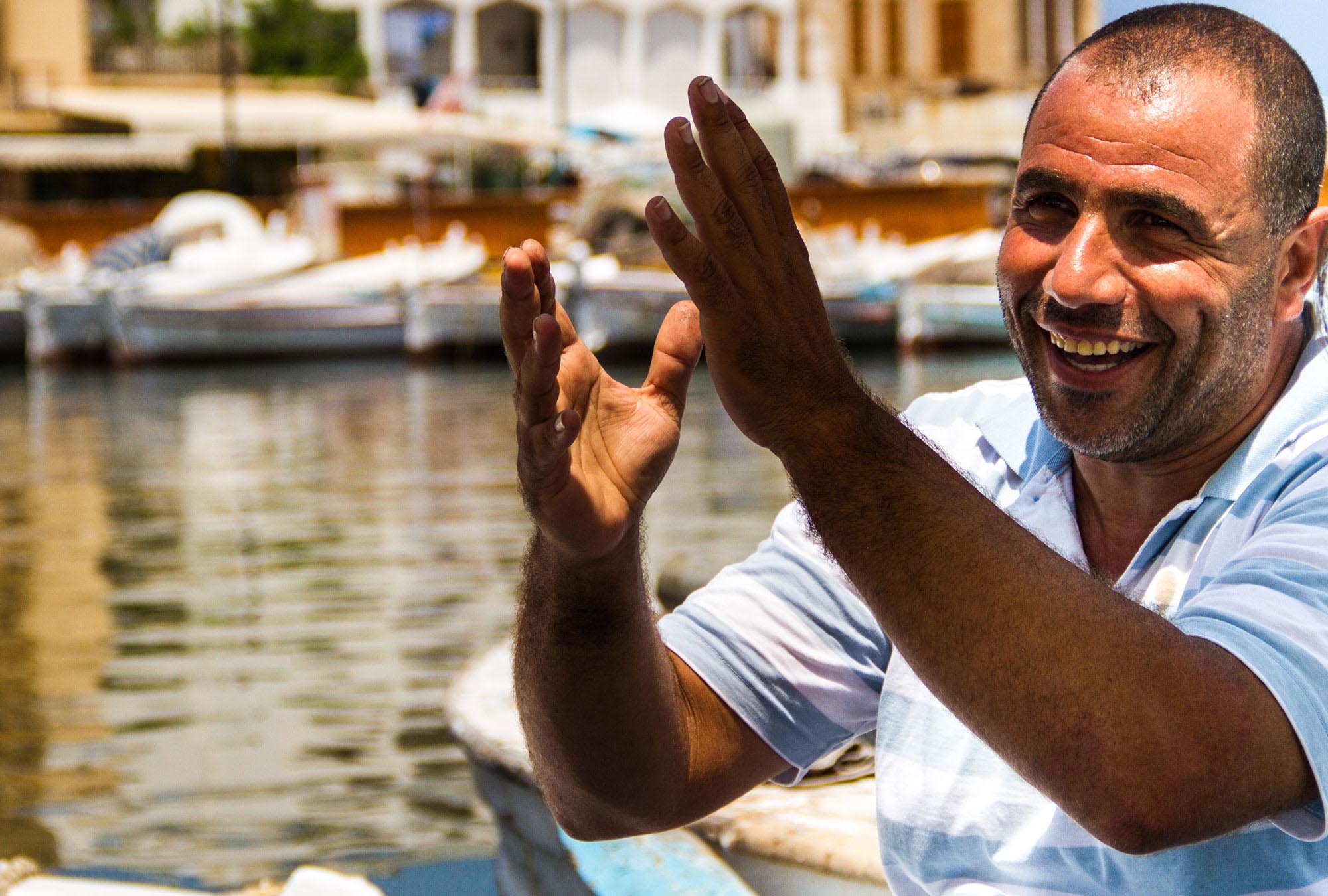 Bilal sits in his fishing boat in Tyre's port, Lebanon. The $1,000 grant he received from Anera after the 2006 war allowed him to wait for the situation to return to normal.